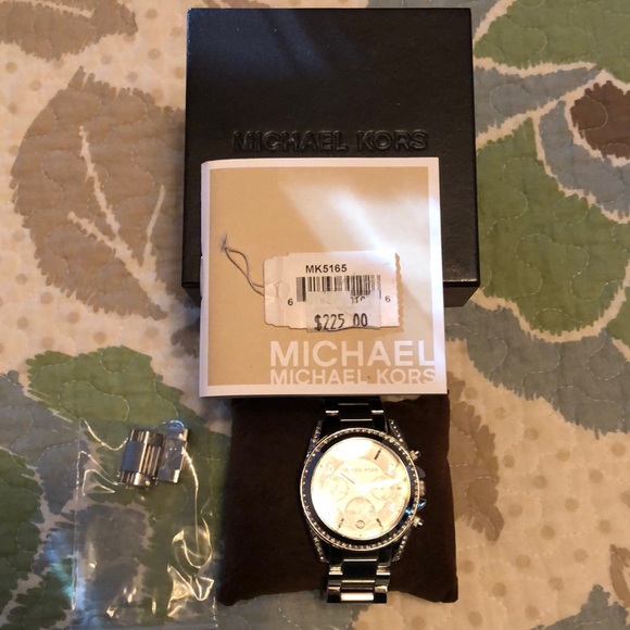 Genuine Michael Kors watch diamond accent.